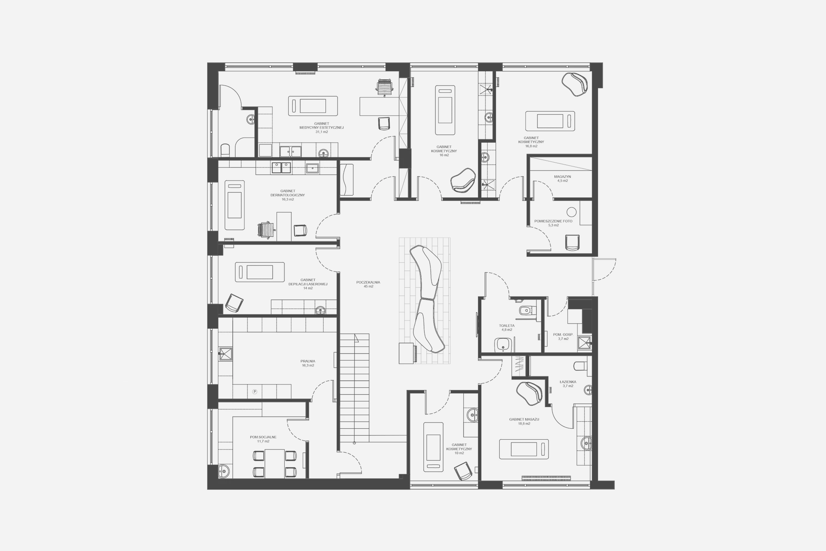 Na piętrze, z położonej centralnie poczekalni, prowadzą drzwi do poszczególnych gabinetów.